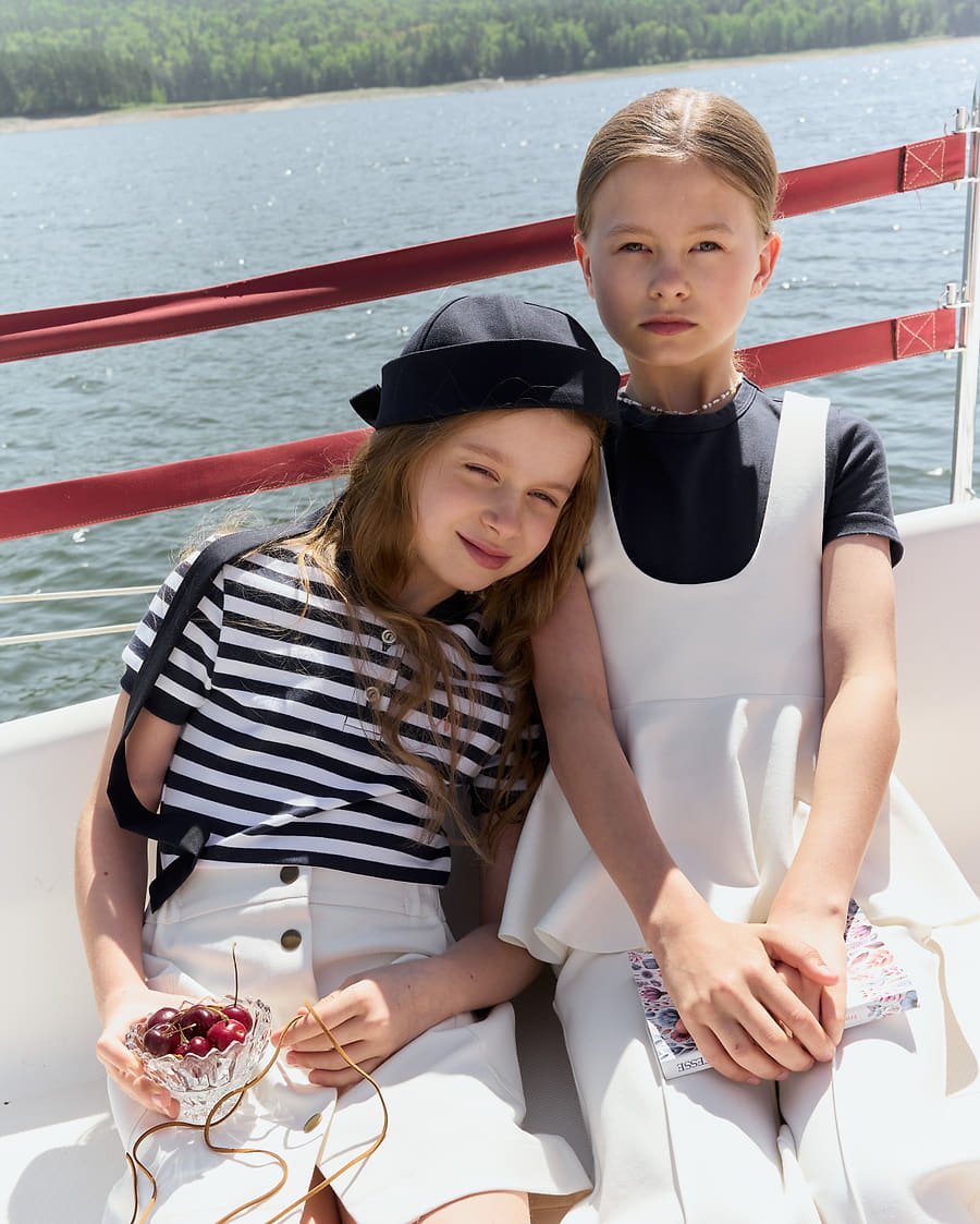 Two girls talking on deck